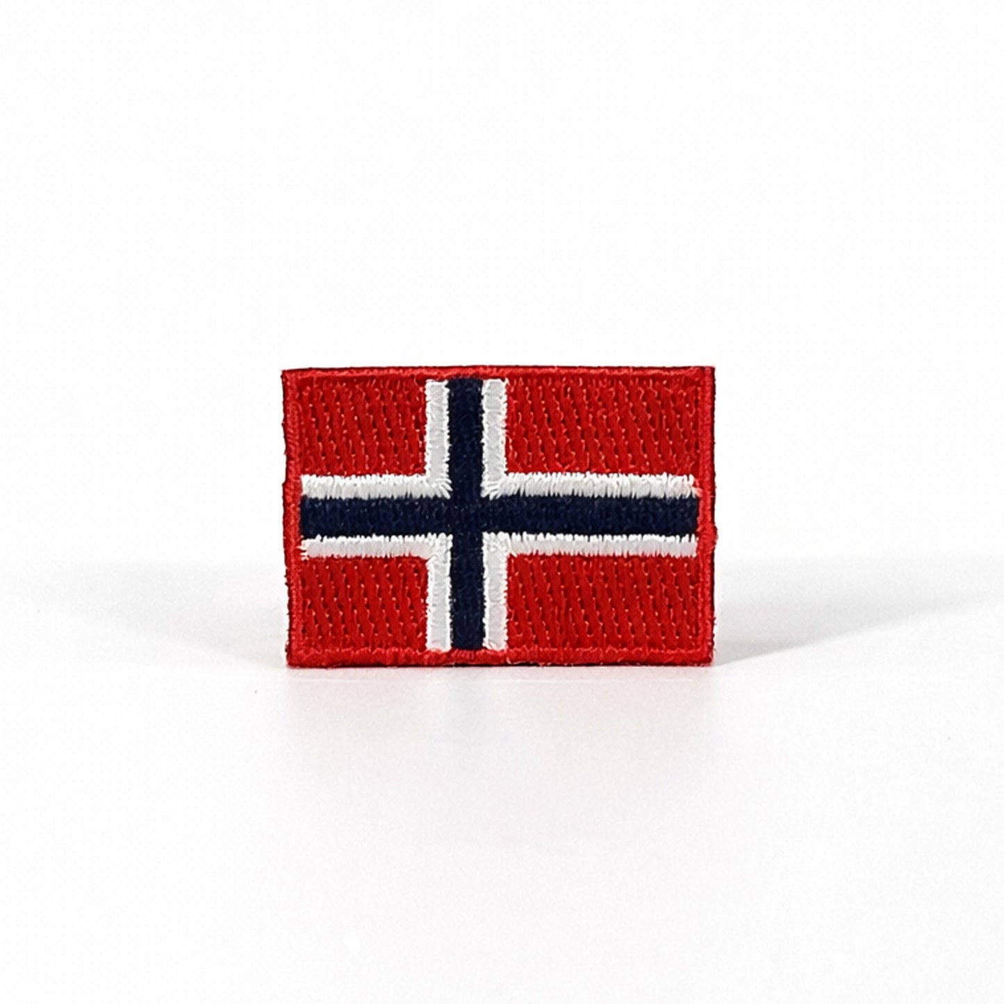 Broderat märke med Norges flagga