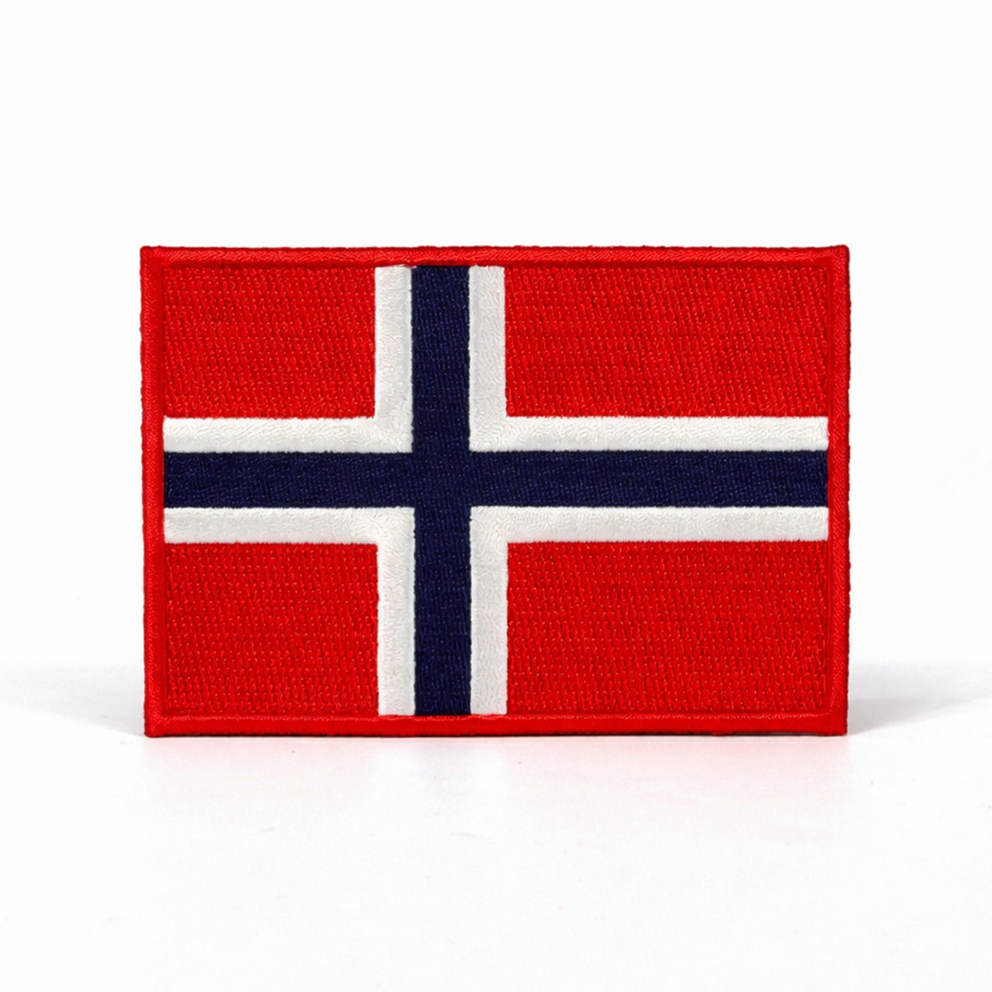 Broderat märke med norges flagga