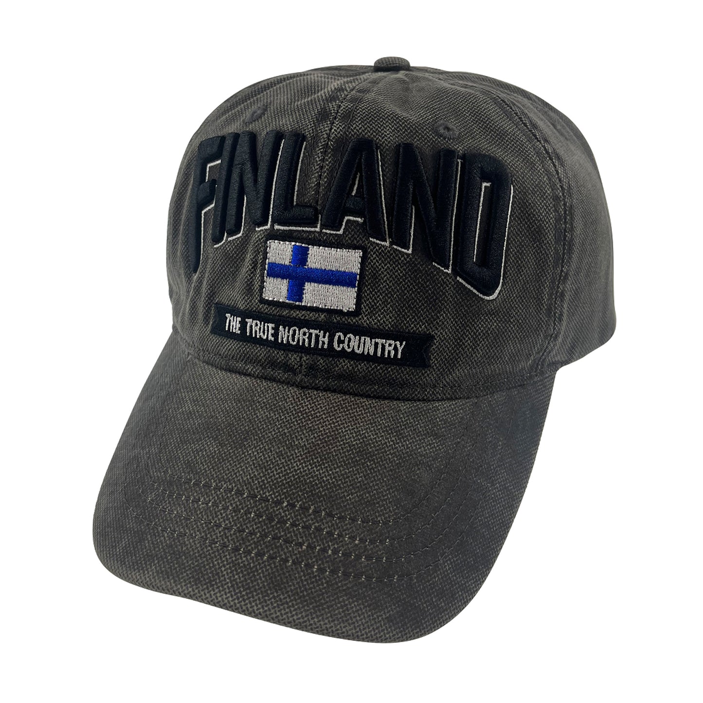 Grå vaxad keps sedd framifrån med broderad finsk flagga och texten Finland i 3D. Den vaxade ytan ger kepsen en distinkt look och känsla.
