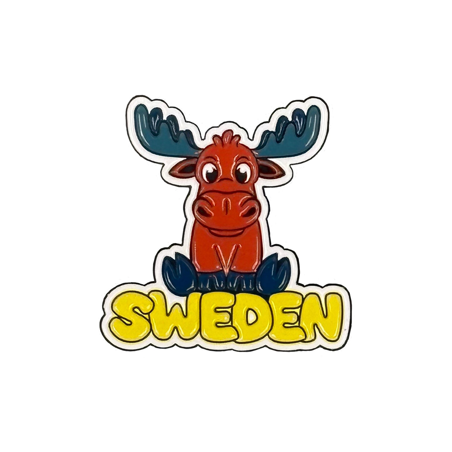Färgglad magnet med en älg med blå horn, perfekt som souvenir eller dekoration.