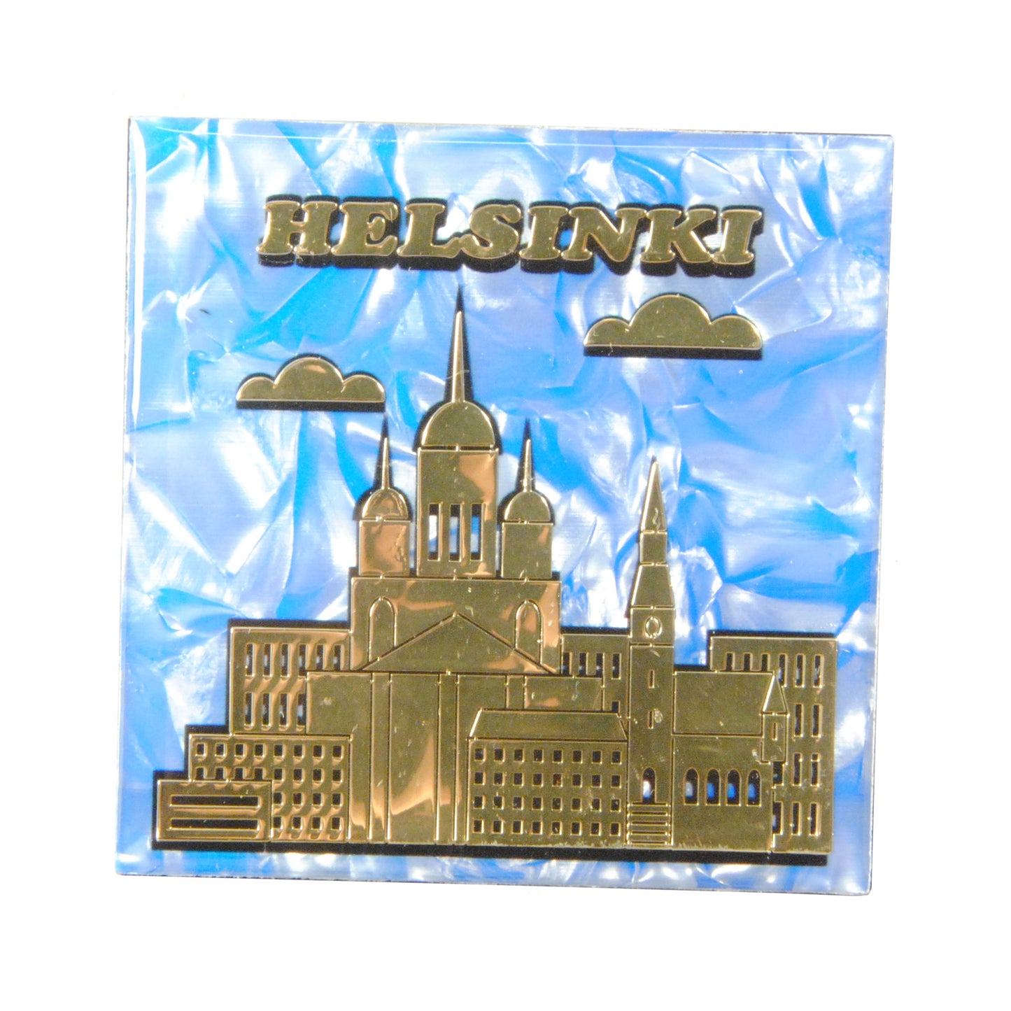 Epoxy-magnet med guldfärgad Helsingfors skyline på blå marmormönstrad bakgrund.