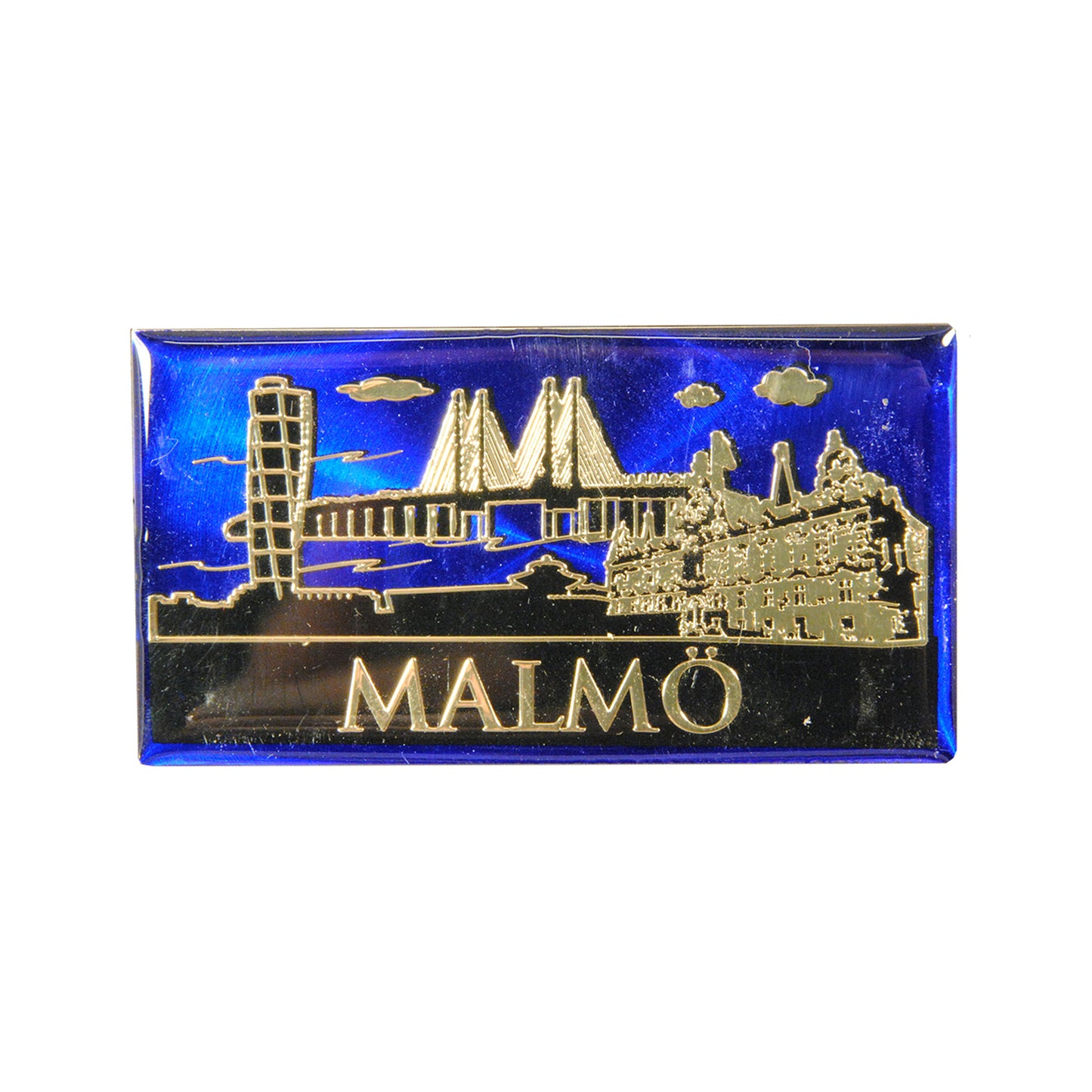 Epoxymagnet med guldfärgad och svart skyline av Malmö mot blå bakgrund. Stilfull och färgstark souvenir.