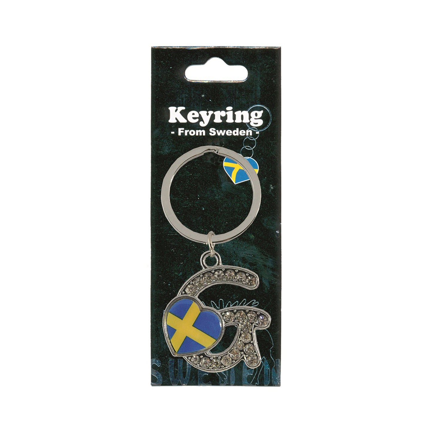 Metallnyckelring med bokstaven G. Bokstaven är dekorerad med glitterstenar. På bokstaven finns även ett hjärta med en svensk flagga. Visas här i sin förpackning. Svart förpackning med texten "Keyring från Sweden" i vitt.