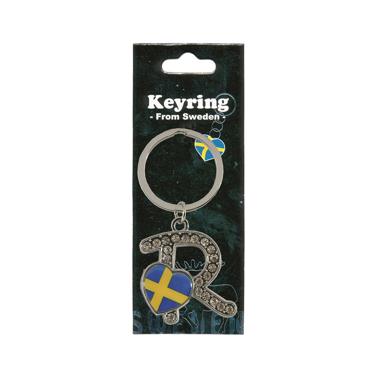 Metallnyckelring med bokstaven R. Bokstaven är dekorerad med glitterstenar. På bokstaven finns även ett hjärta med en svensk flagga. Visas här i sin förpackning. Svart förpackning med texten "Keyring från Sweden" i vitt.