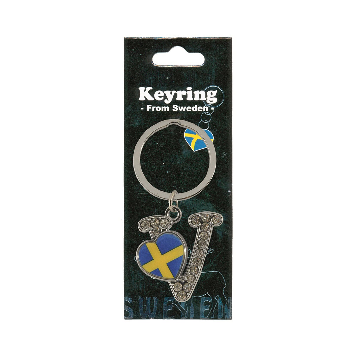 Metallnyckelring med bokstaven V. Bokstaven är dekorerad med glitterstenar. På bokstaven finns även ett hjärta med en svensk flagga. Visas här i sin förpackning. Svart förpackning med texten "Keyring från Sweden" i vitt.