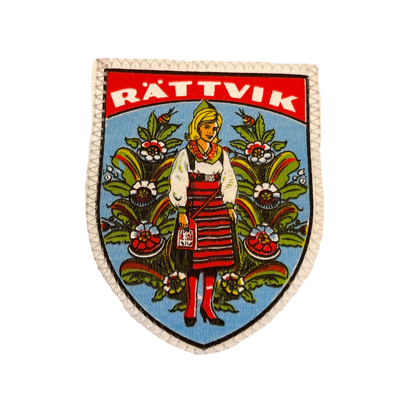 Tygmärke med motiv av en Rättviksflicka och kurbits – klassiskt souvenirmärke i vintage stil, 60x82 mm, perfekt att sy fast på jacka, väska eller ryggsäck.