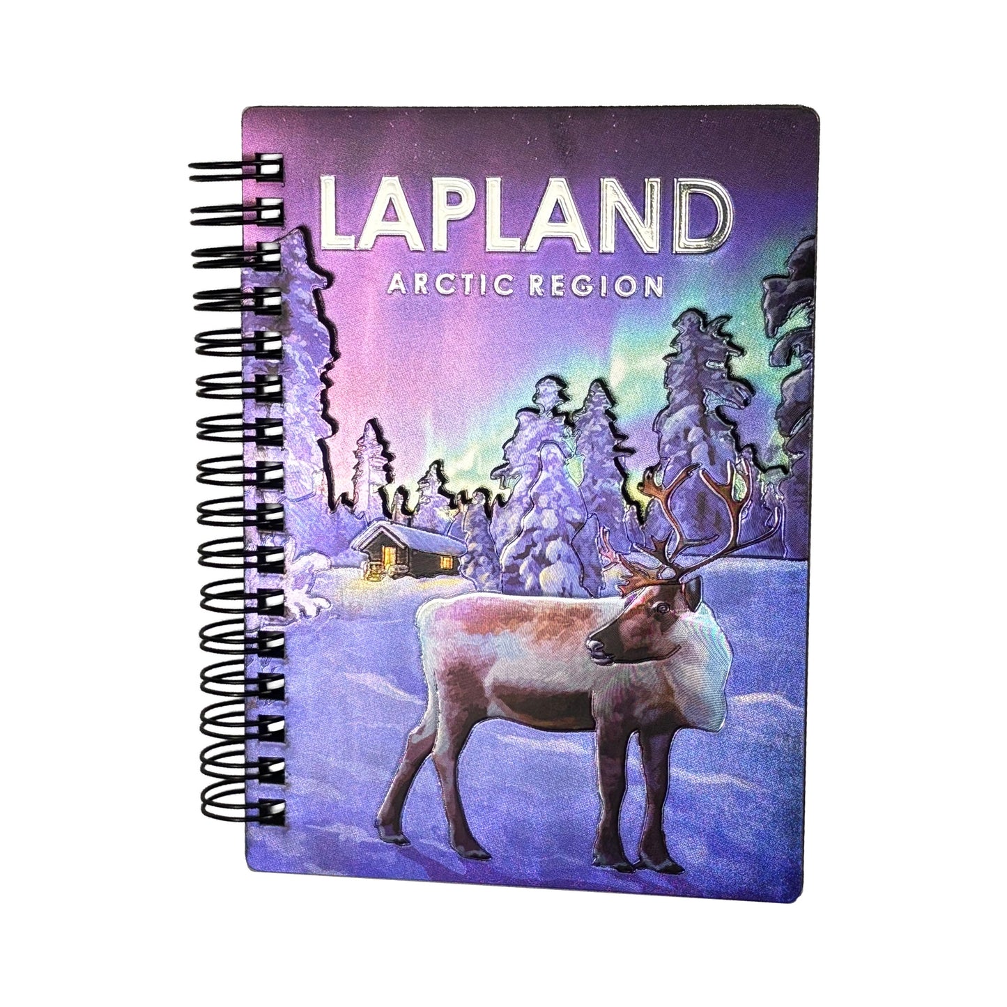 Anteckningsblock med omslag som visar en vacker illustration av en ren i vackert vinterlandskap och norrsken i bakgrunden. 