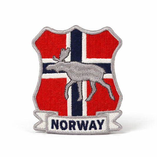 Broderat märke med Norges flagga med en älg och nedtill texten "NORWAY".