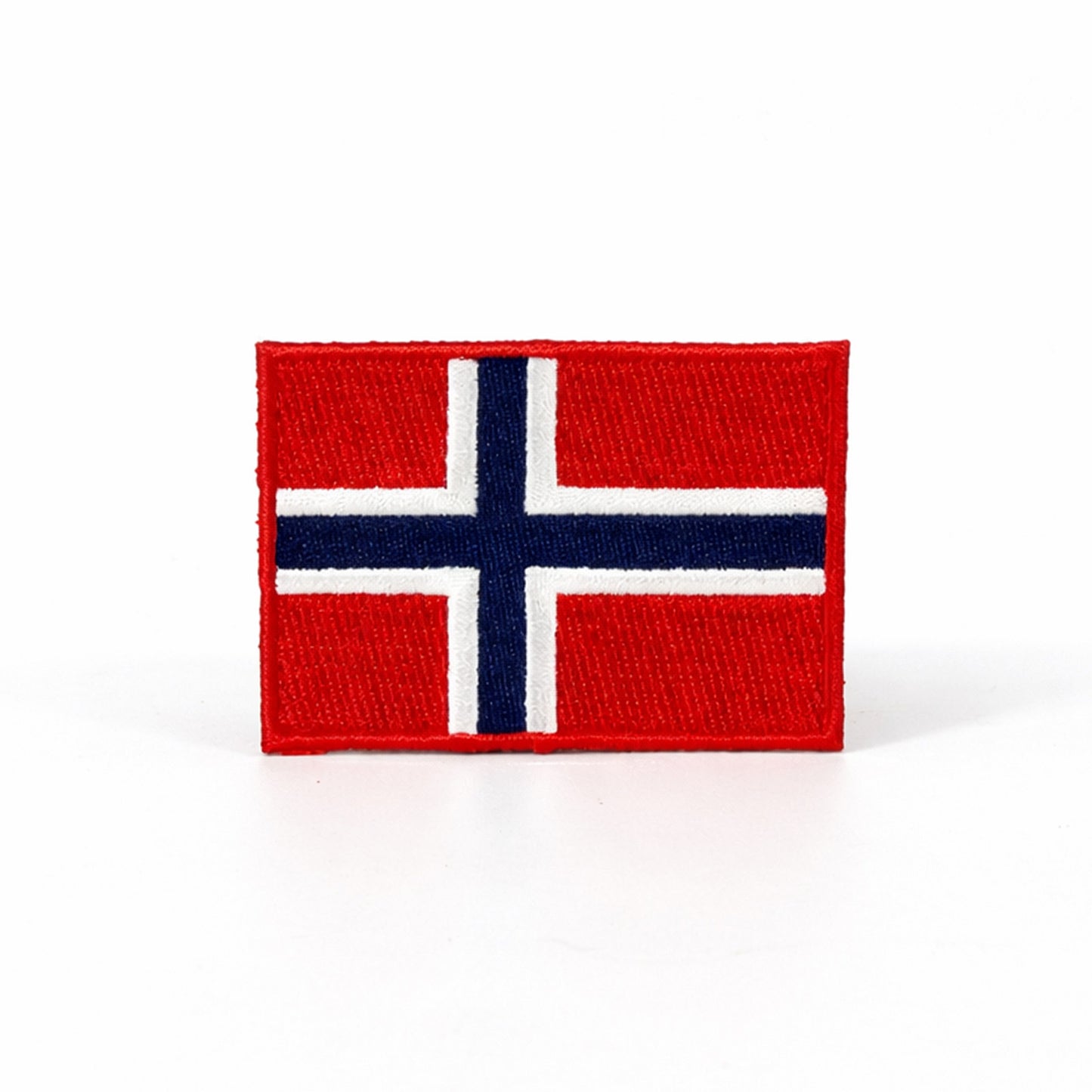 Broderat märke med norges flagga