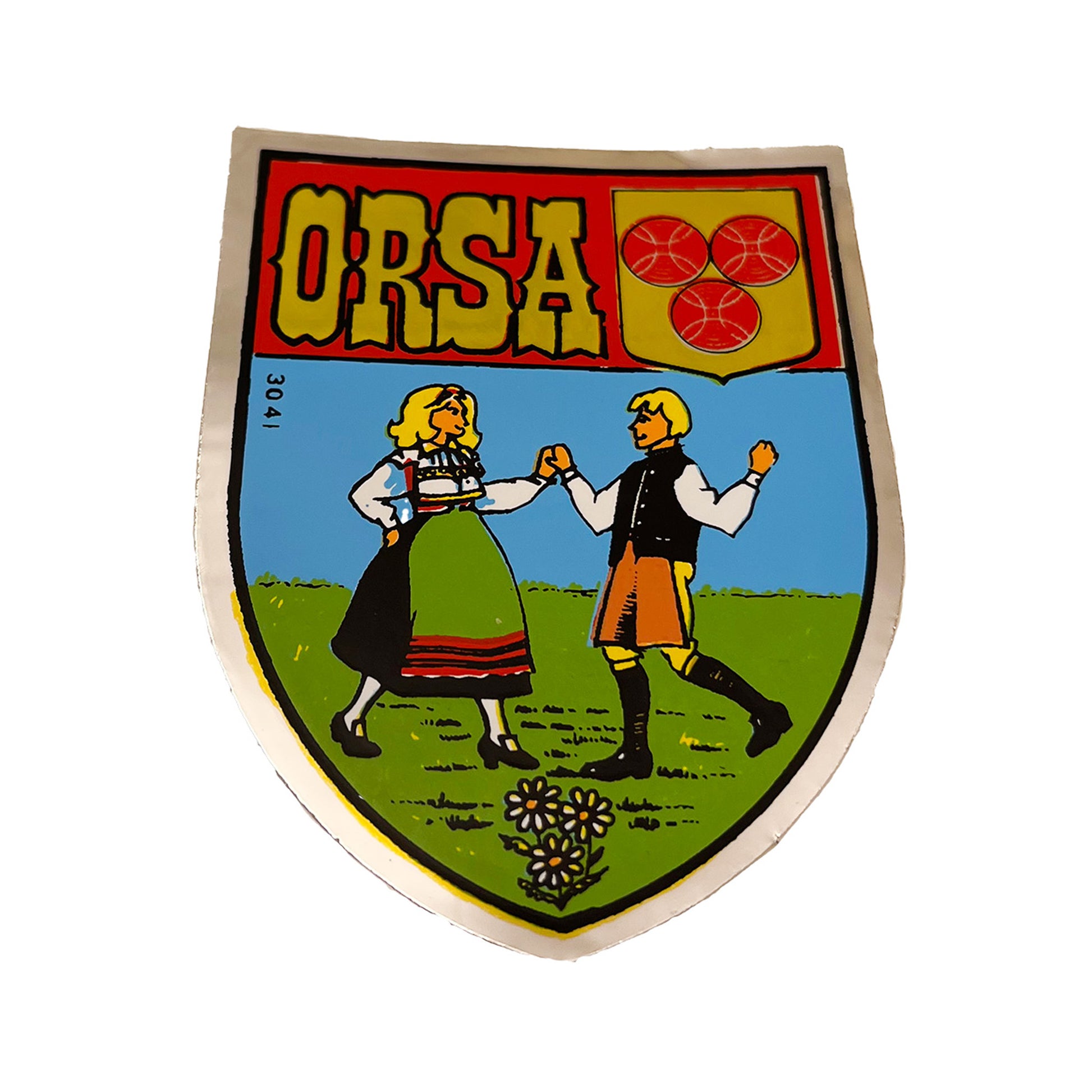 Sköldformad dekal med motiv av ett dansande par från Orsa. Storlek 6 x 7,8 cm – en fin souvenir med traditionell svensk känsla.