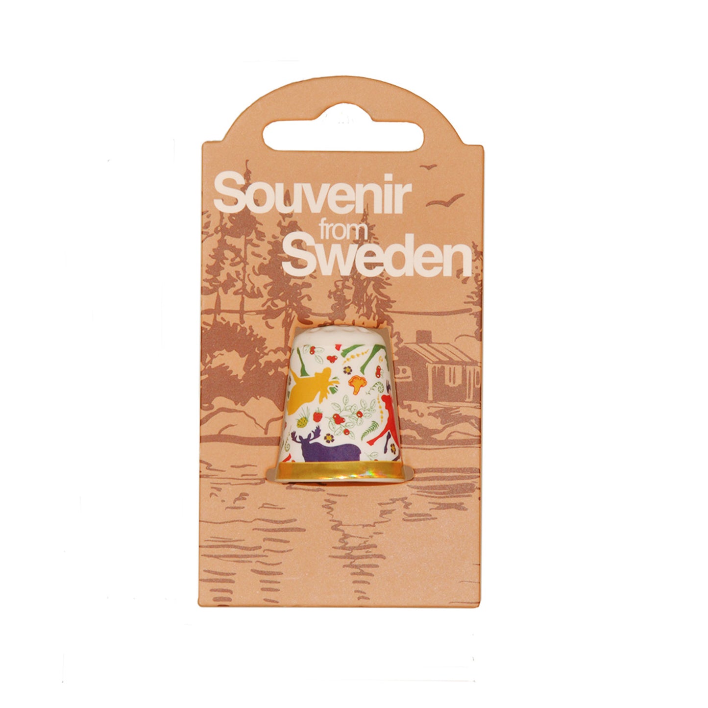 Förpackning med fingerborg i porslin med motiv av färgglada älgar. På förpackningen står det "Souvenir from Sweden".