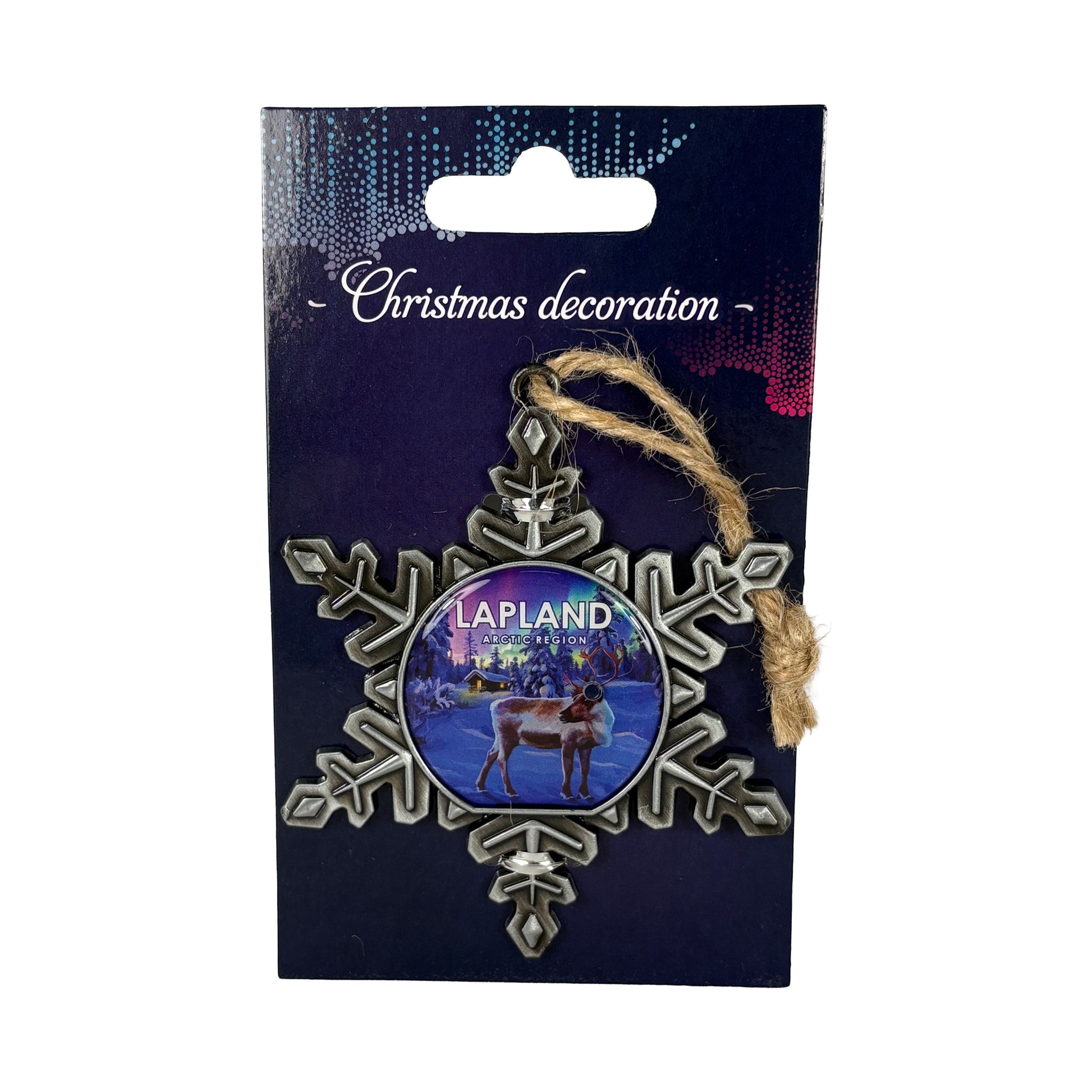 Julstjärna i metall i förpackning med norrskensinspirerat motiv och texten "Christmas Decoration".
