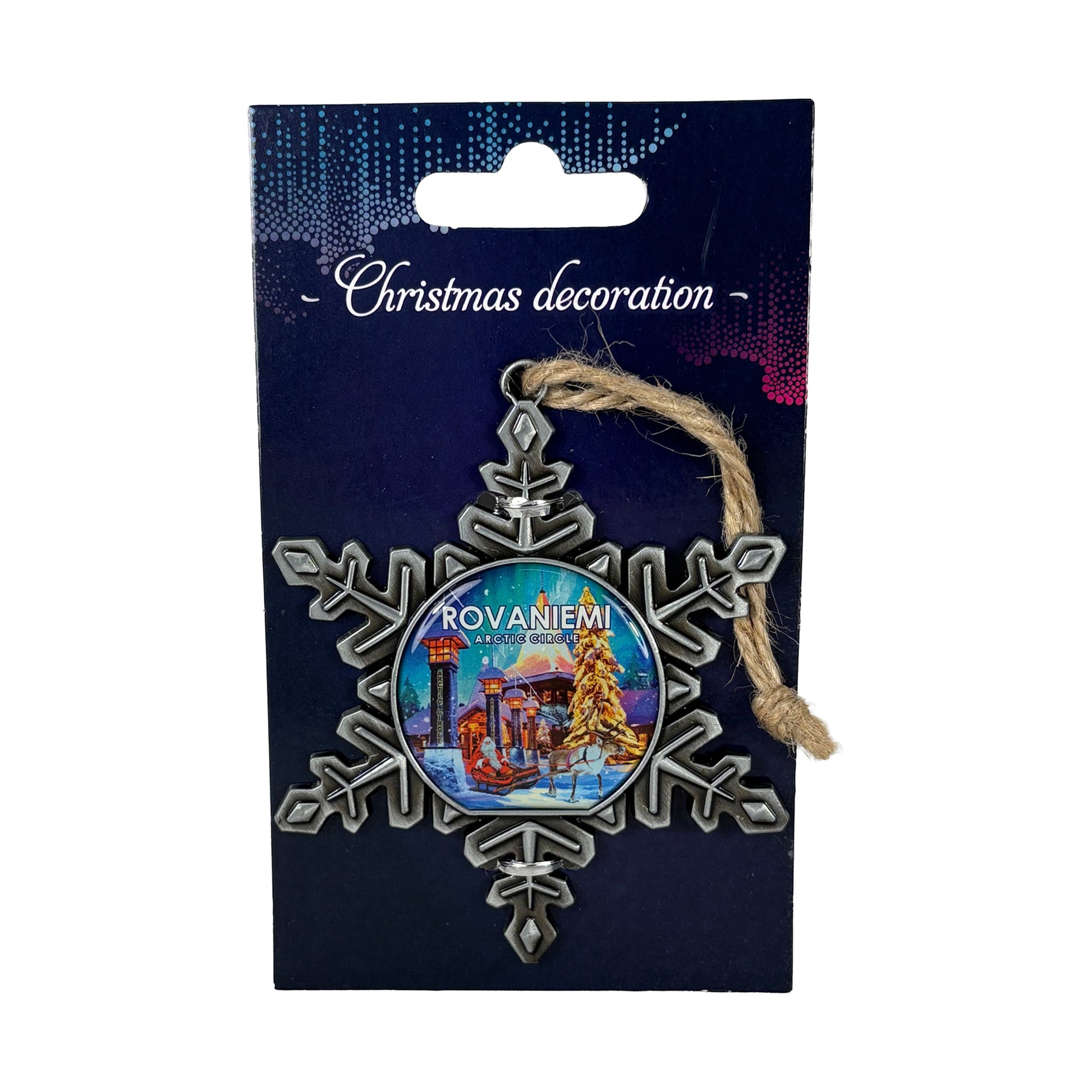 Metalljulstjärna i förpackning med norrskensinspirerat motiv och texten "Christmas Decoration".