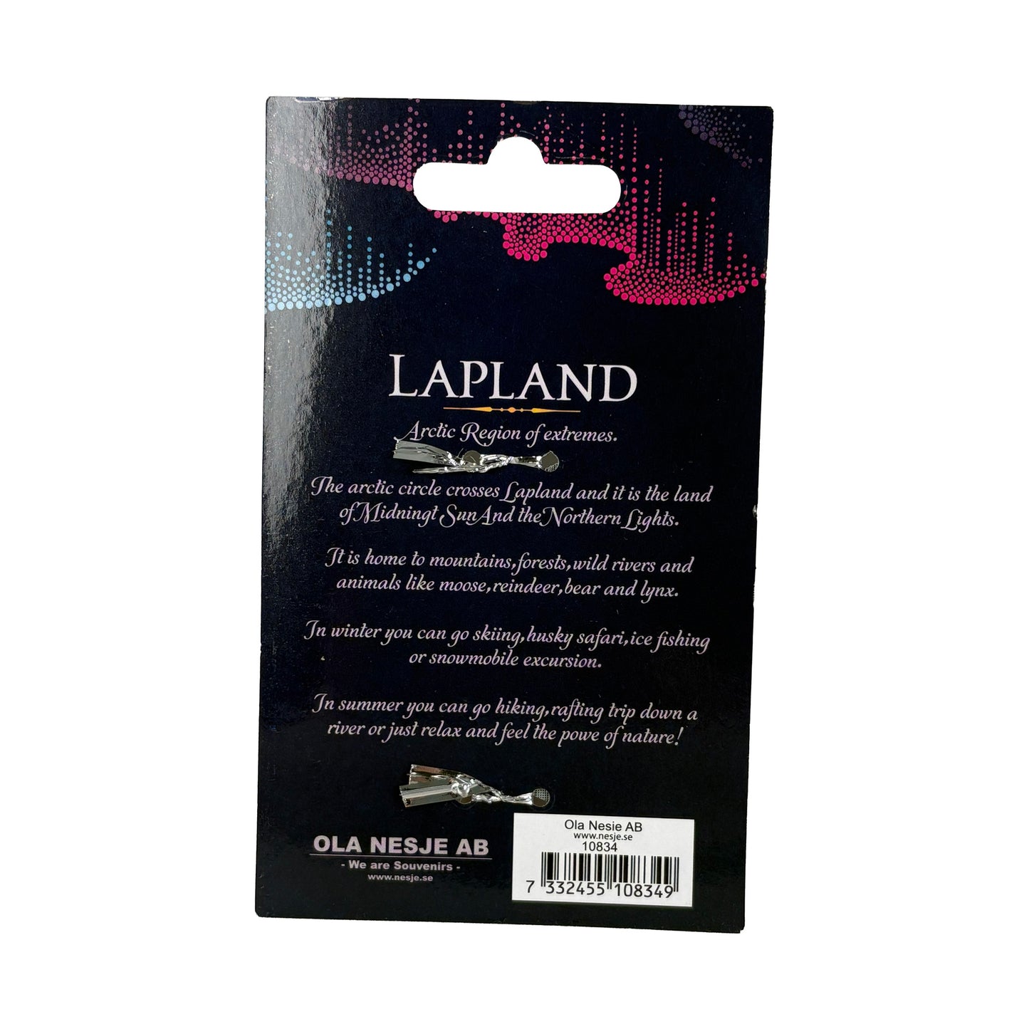 Baksida av förpackning till metalljulstjärna, med kort text om Lapland.