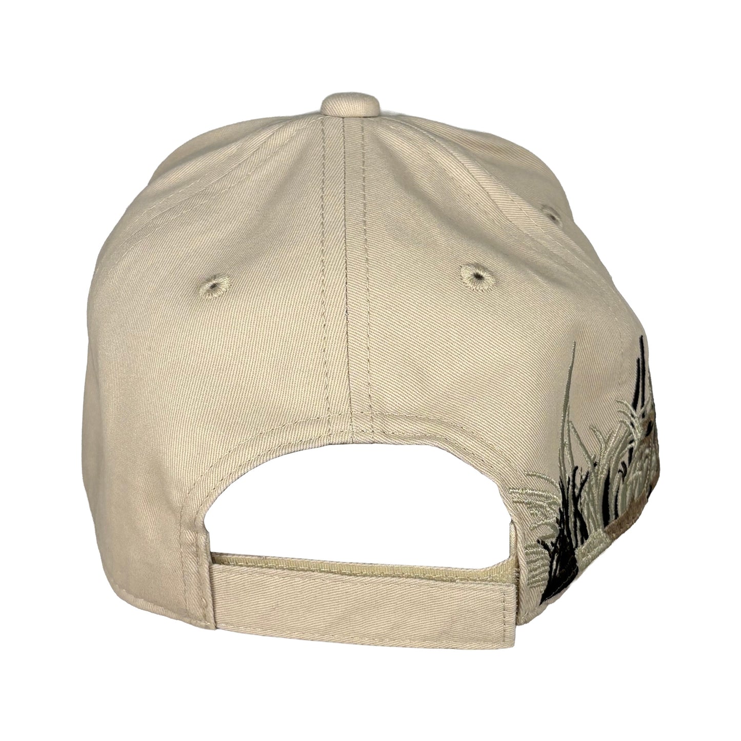 Beige keps bakifrån med justerbar rem och kardborreband.