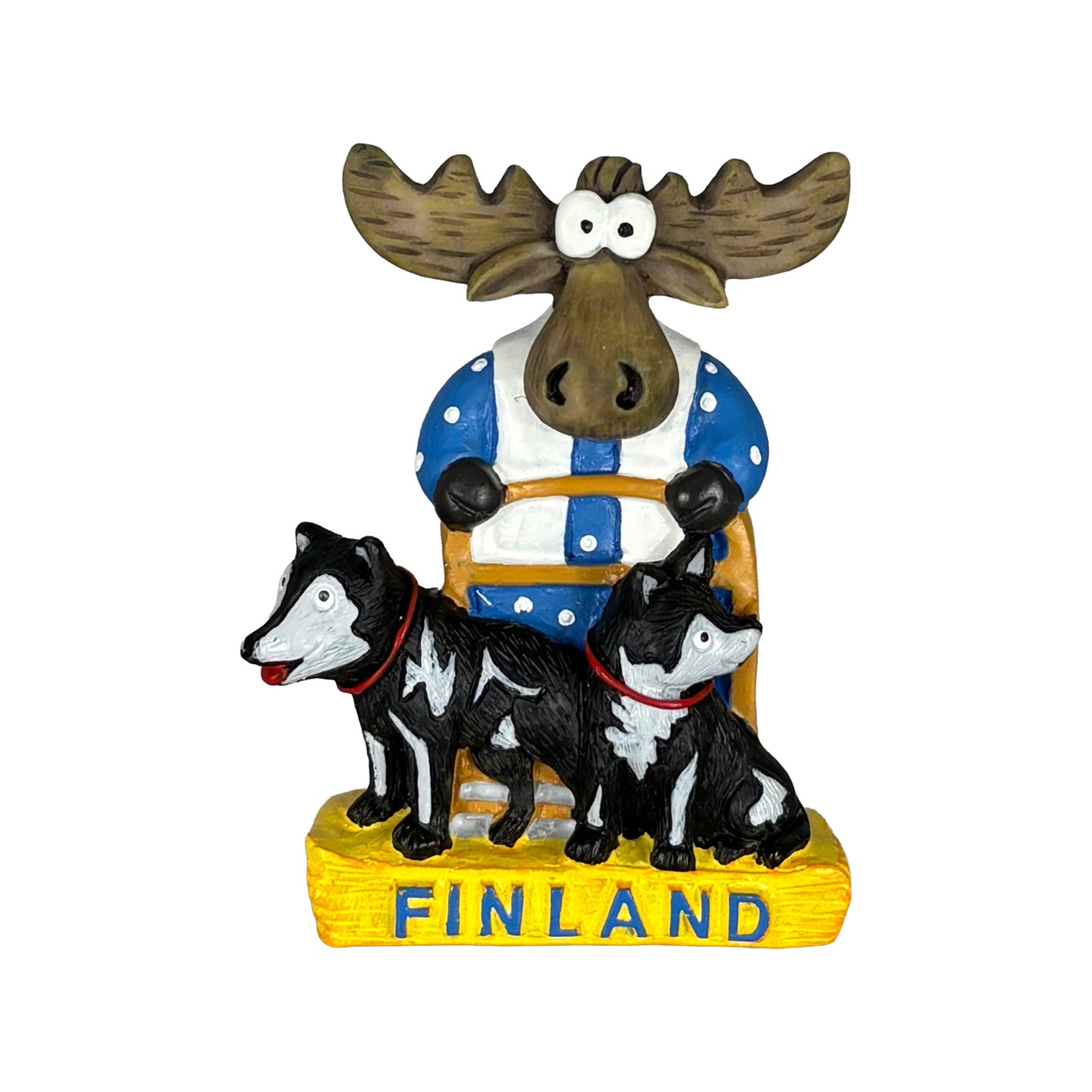 Magnet föreställande en älg som kör ett hundspann. En charmig finsk souvenir som fångar nordisk natur och äventyr.