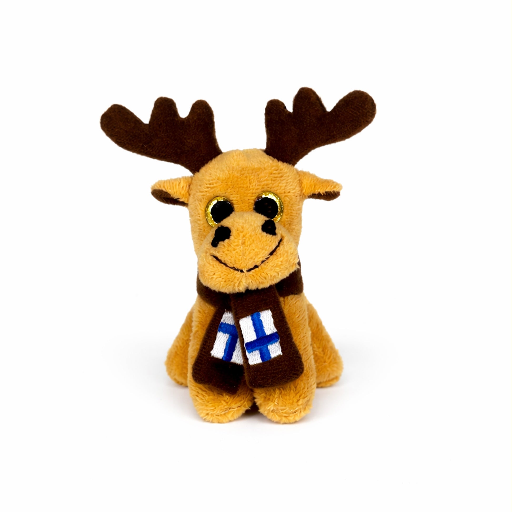 Beige älg magnet med gula glittrande ögon och brun halsduk med finska flaggan på.  