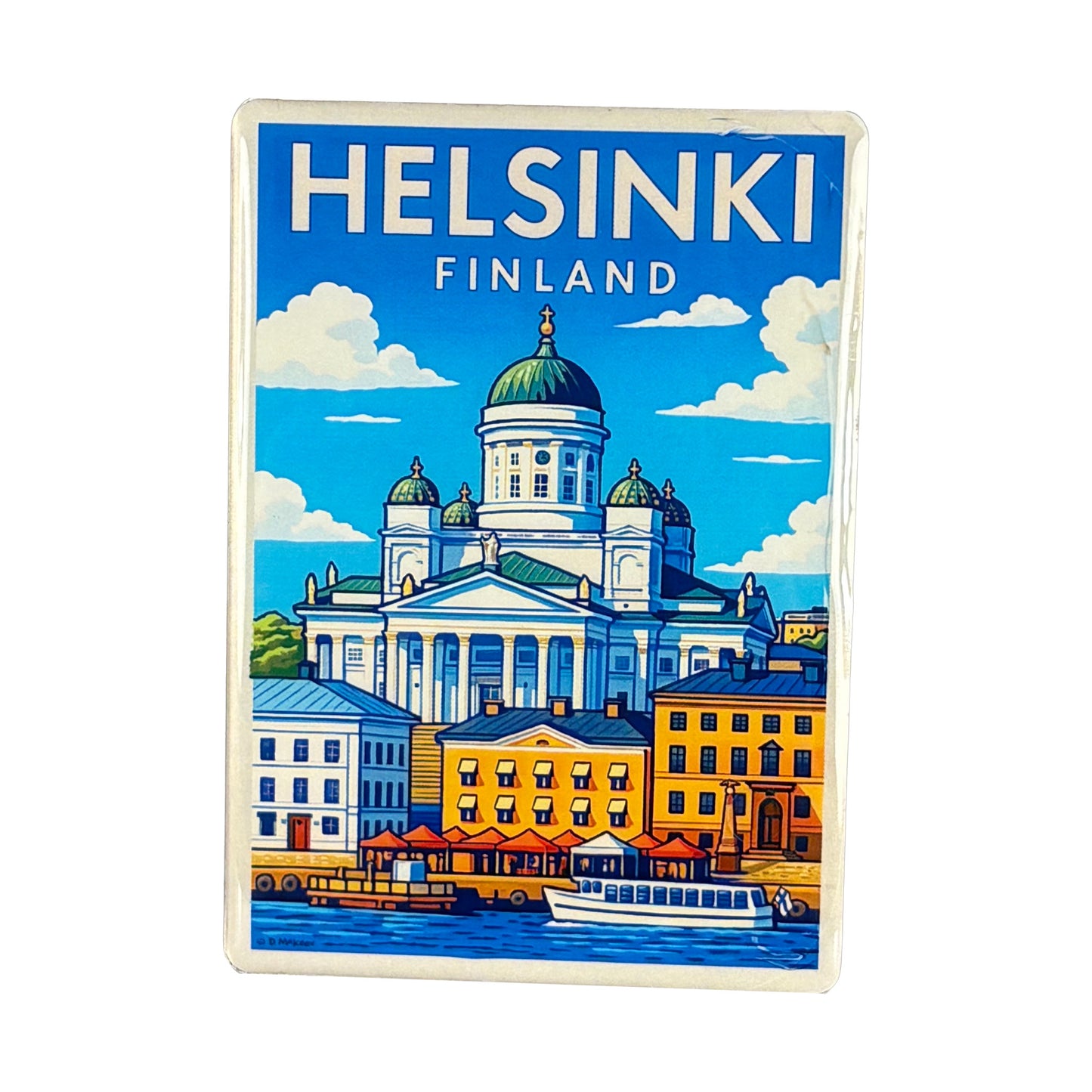 Rektangulär magnet med motiv från Helsingfors och texten "Helsinki Finland".

