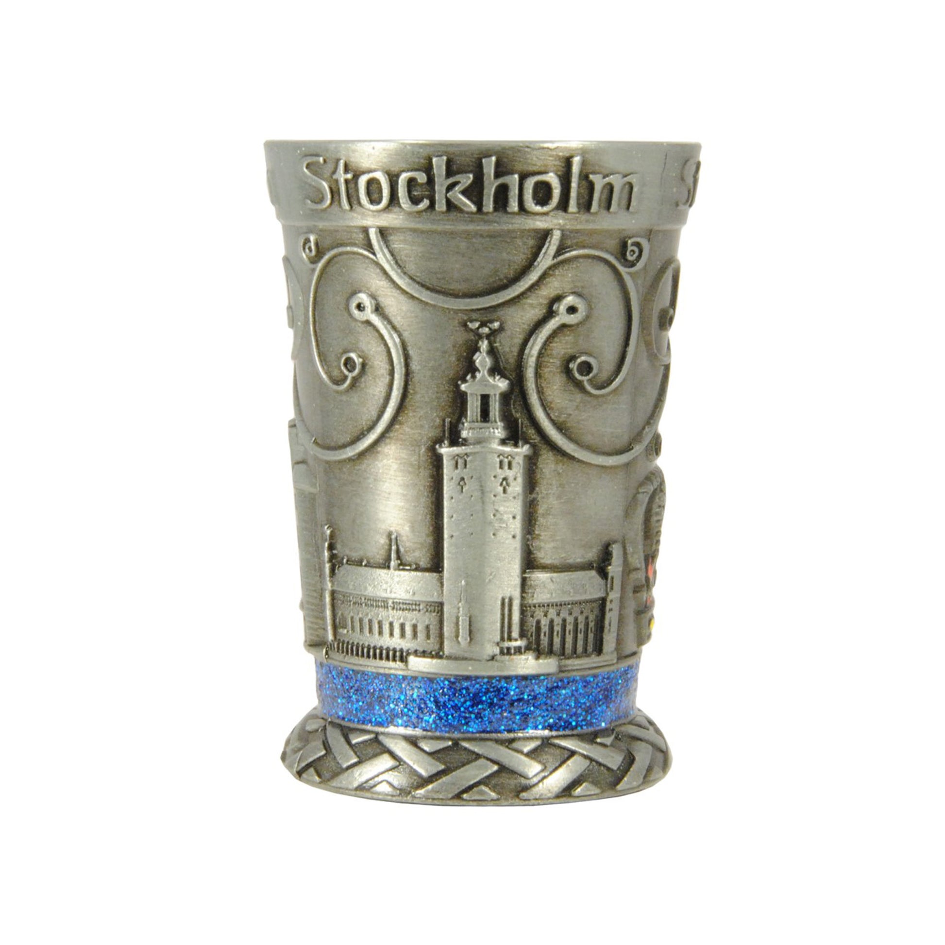 Metallshotglas med blå glitterkristaller och motiv i relief av Stadshuset – ett av tre motiv på glaset.
