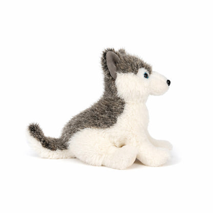 Stor grå gosedjurs husky sedd från sidan.