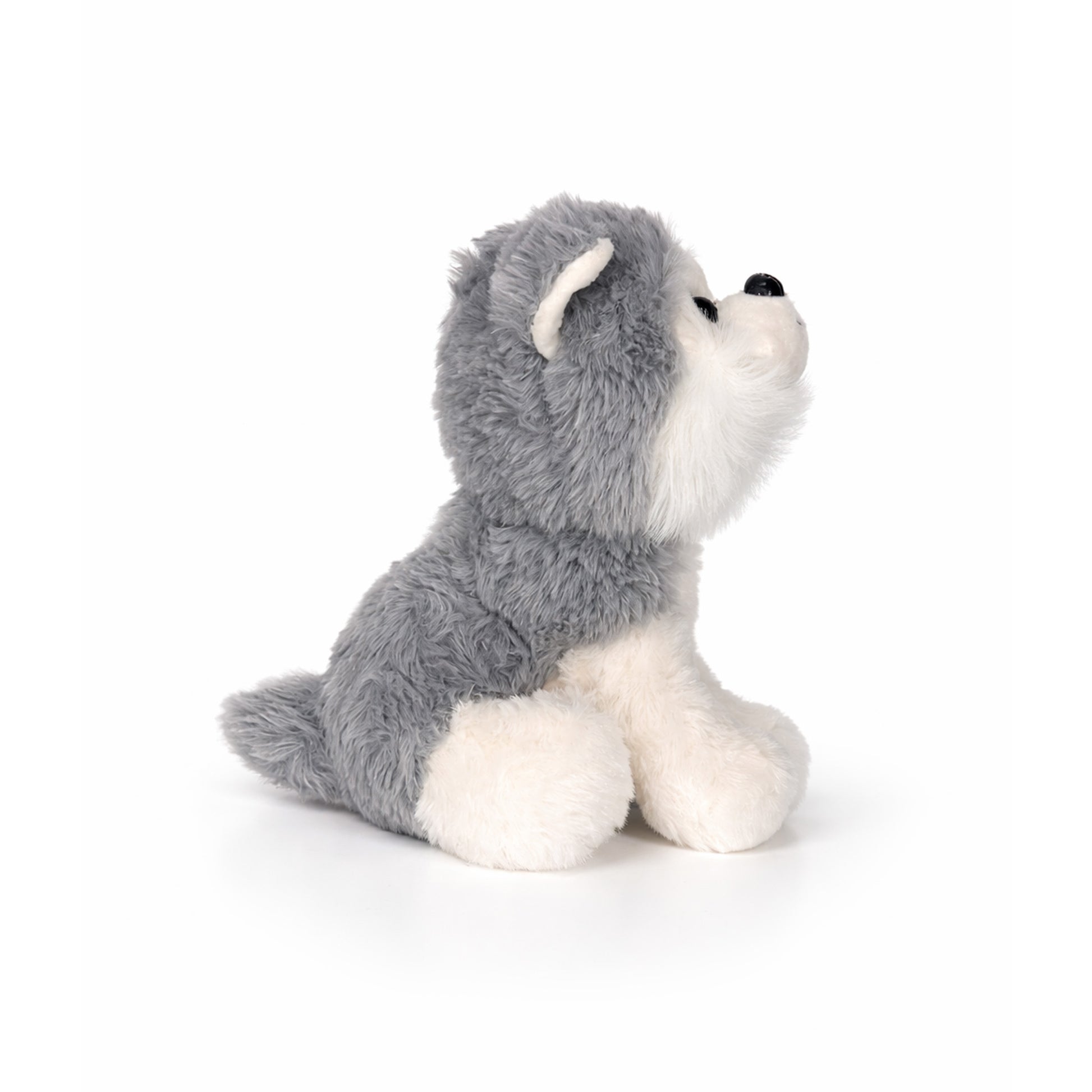 Mjuk och gosig gosedjurshund i form av en huskie, perfekt som kramkompis och charmig souvenir. sedd från sidan
