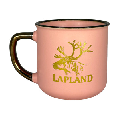 Baksidan av aprikosfärgad mugg med samma guldfärgade motiv.