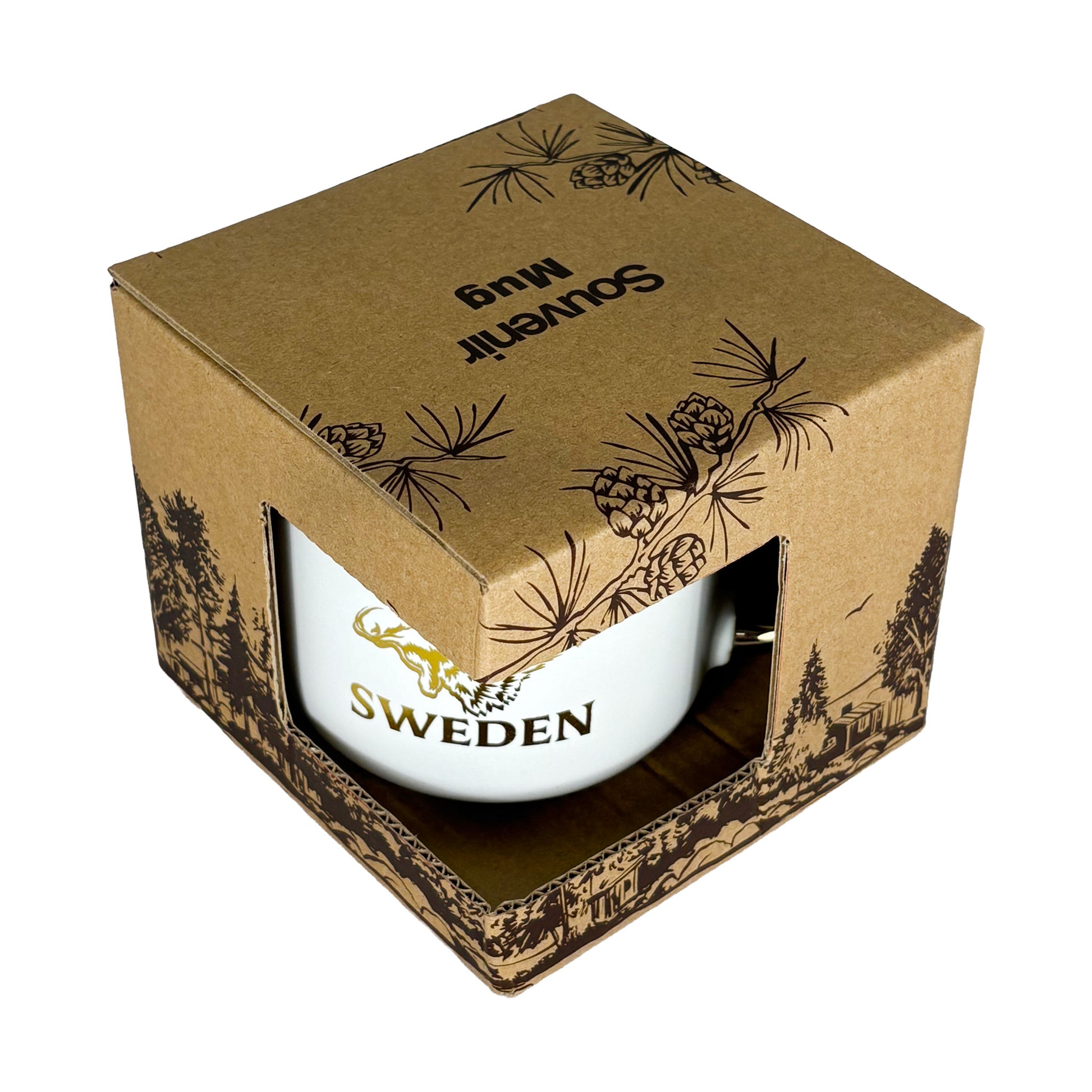 Muggen i förpackning sedd snett uppifrån med texten "Souvenir Mug" synlig på toppen.