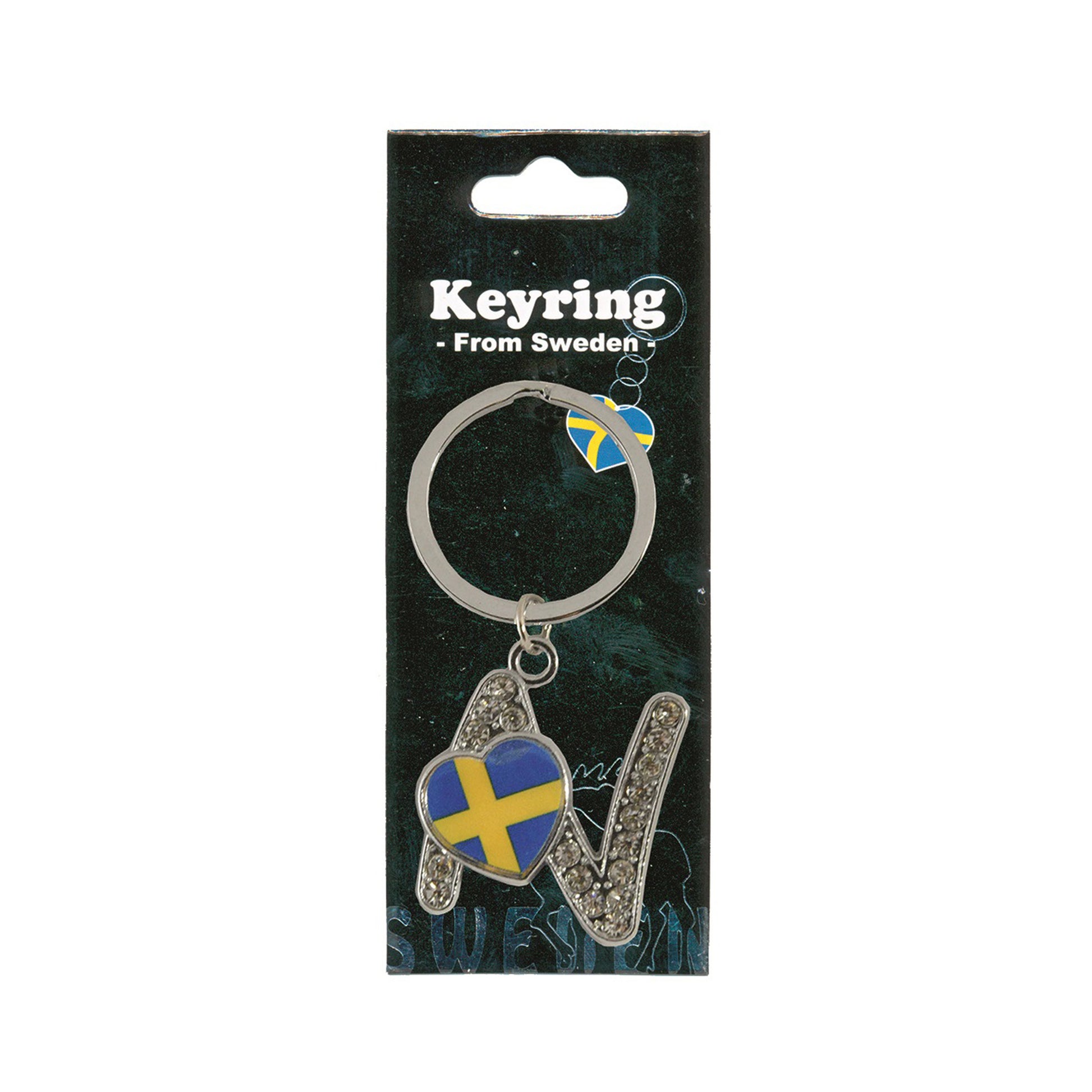 Metallnyckelring med bokstaven N. Bokstaven är dekorerad med glitterstenar. På bokstaven finns även ett hjärta med en svensk flagga. Visas här i sin förpackning. Svart förpackning med  texten "Keyring från Sweden" i vitt.