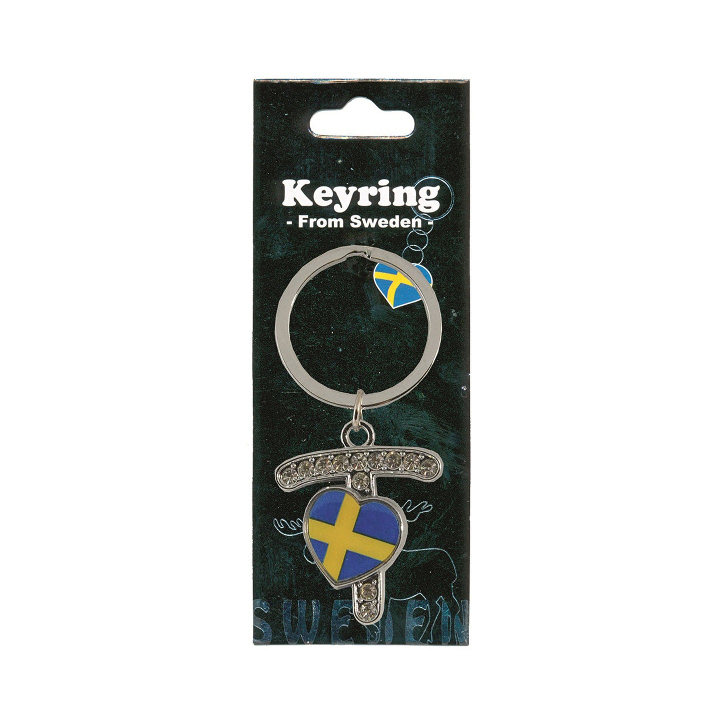 Metallnyckelring med bokstaven T. Bokstaven är dekorerad med glitterstenar. På bokstaven finns även ett hjärta med en svensk flagga. Visas här i sin förpackning. Svart förpackning med  texten "Keyring från Sweden" i vitt.