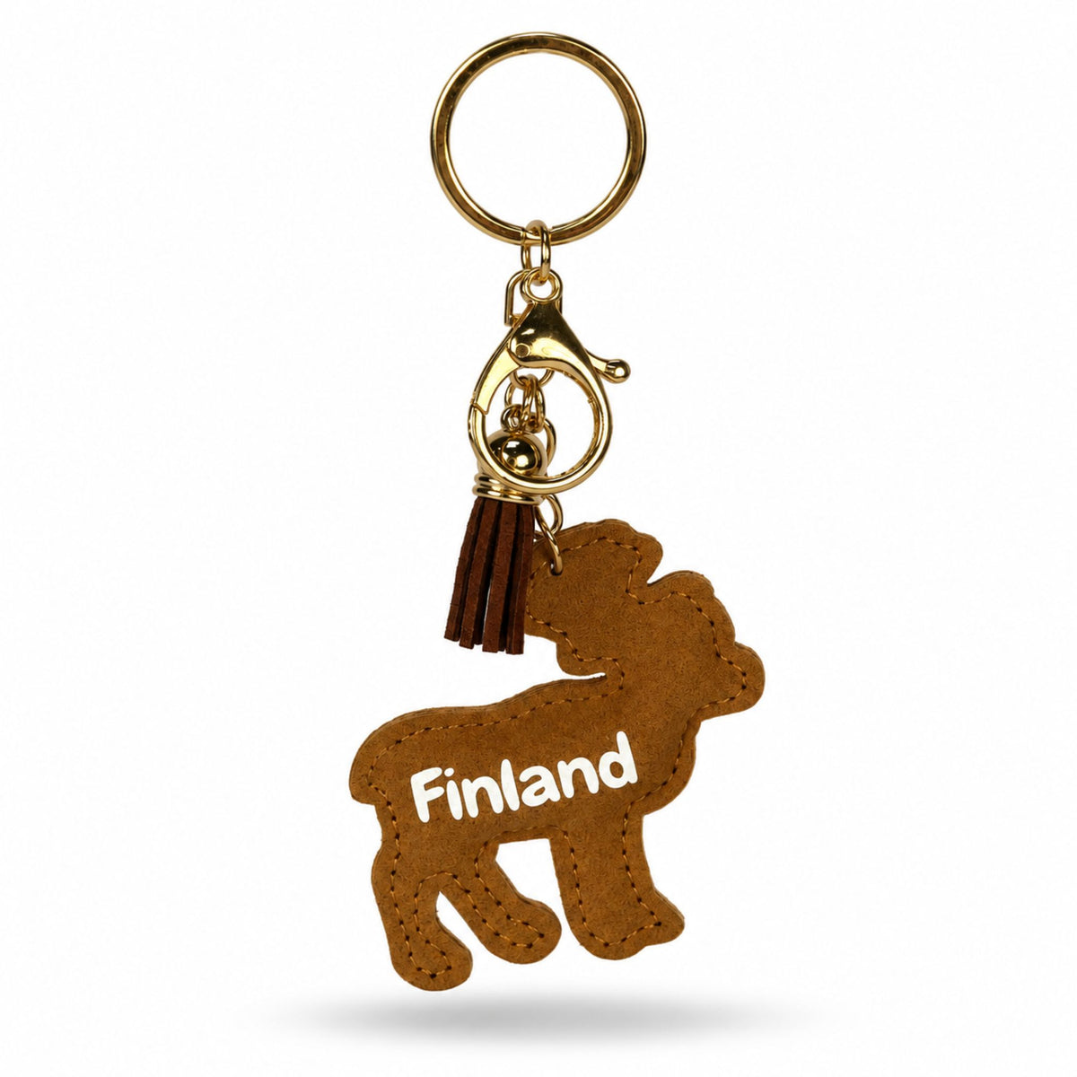 Baksidan av en brun ren formad nyckelring med texten "FINLAND". Nyckelringen har en brun tofs samt en guldfärgad karbinhake och ring.