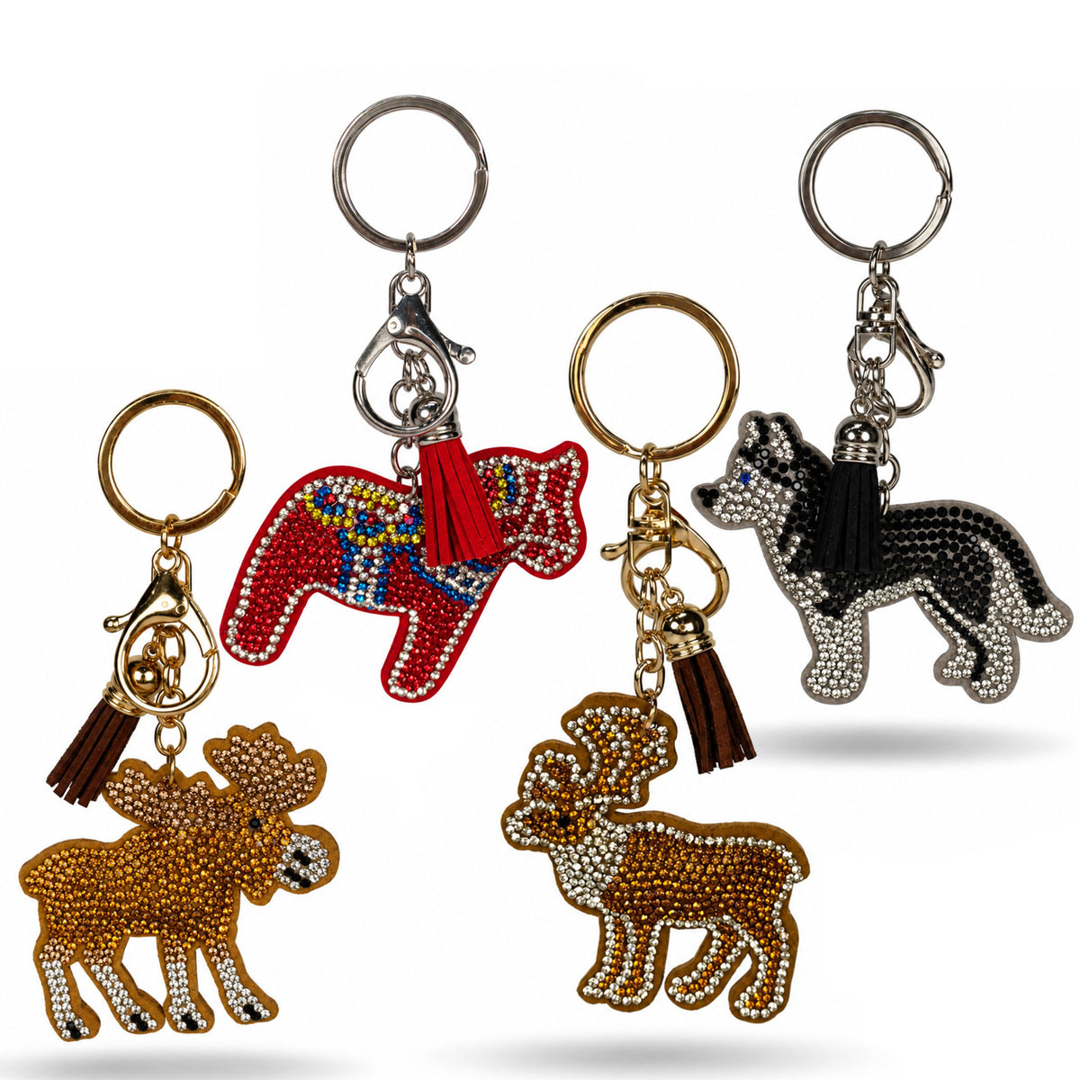 Hela kollektionen av våra nyckelringar med glitter. Den består av en älg, en dalahäst, en ren och en husky - alla med glitter på och en toft, karbinhake och nyckelring.