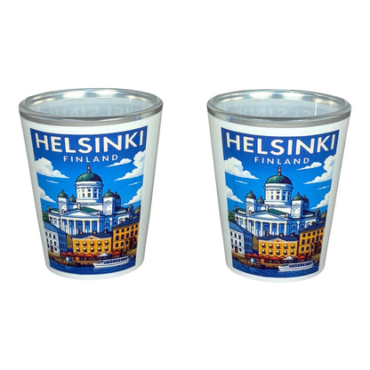Två shotglas med illustration från Helsingfors, inklusive Domkyrkan och texten "Helsinki".
