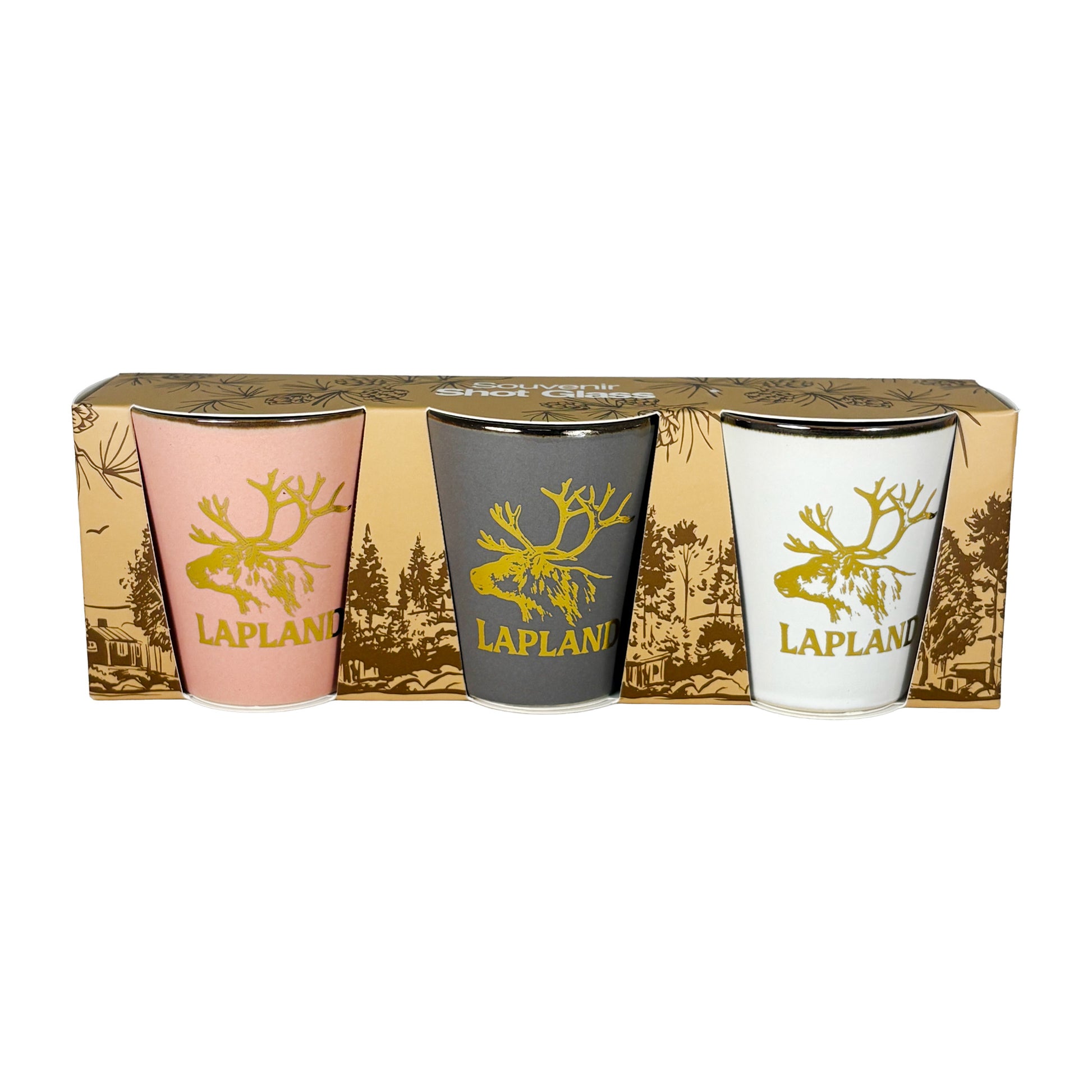 Tre shotglas i rosa, vitt och grått med guldfärgat renhuvud och texten "Lapland". Visas här framifrån i sin förpackning. 