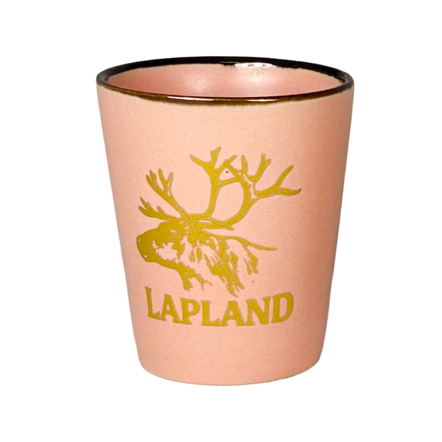 Rosa shotglas med guldfärgat renhuvud och texten "Lapland".