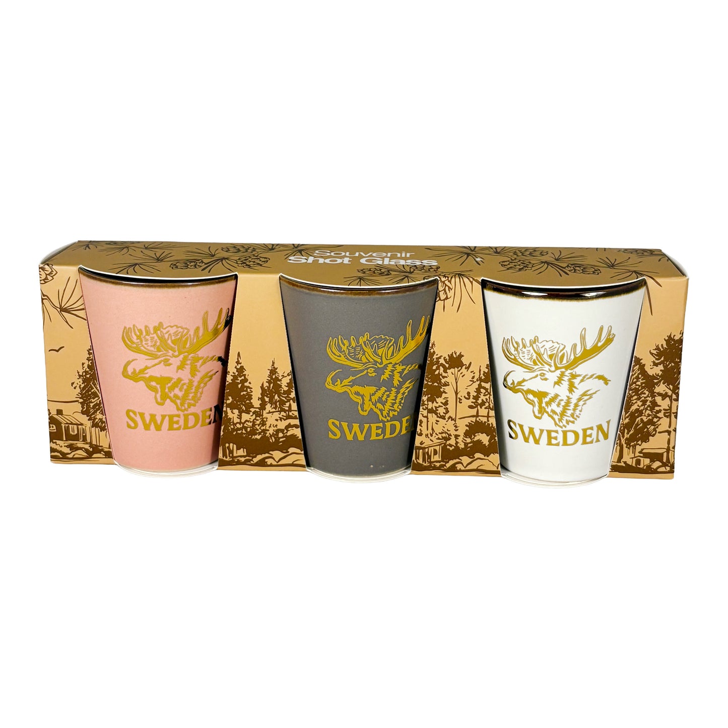 Tre shotglas ett rosa, ett vitt och ett grått. Alla med guldfärgat älghuvud och texten "Sweden". Visas här framifrån i sin förpackning. 