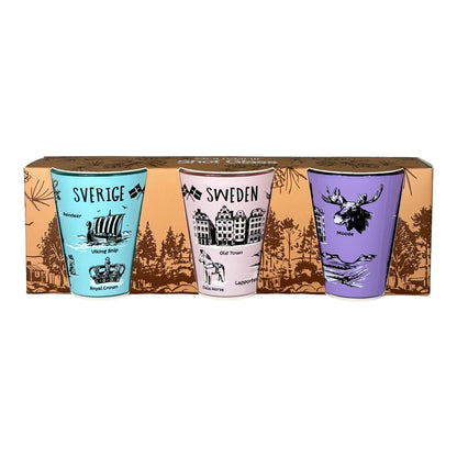 Shotglas 3-pack i förpackning, sett framifrån med de tre färgglada glasen tydligt synliga.