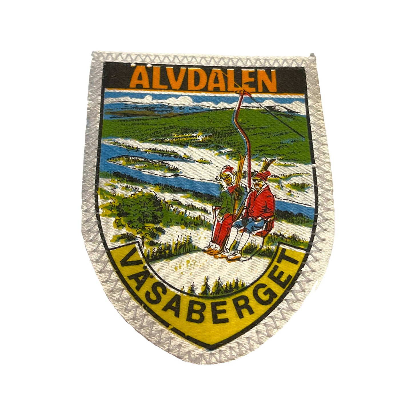 Tygmärke med motiv från Älvdalen och Väsaberget. Klassisk design med en nostalgisk och vintage känsla.