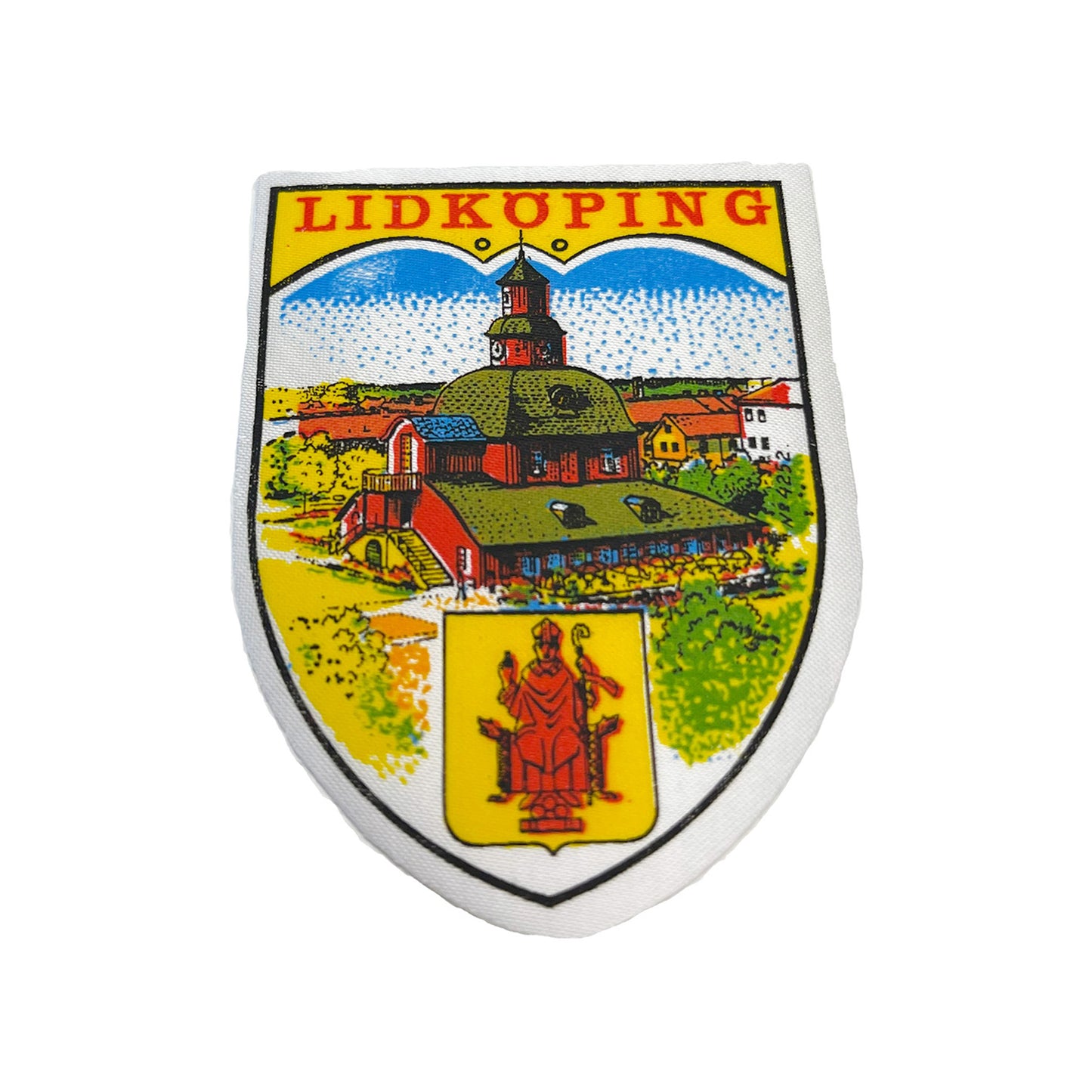 Tygmärke med motiv från Lidköping – klassiskt souvenirmärke i vintage stil, 60x82 mm, perfekt att sy fast på jacka, väska eller ryggsäck.

