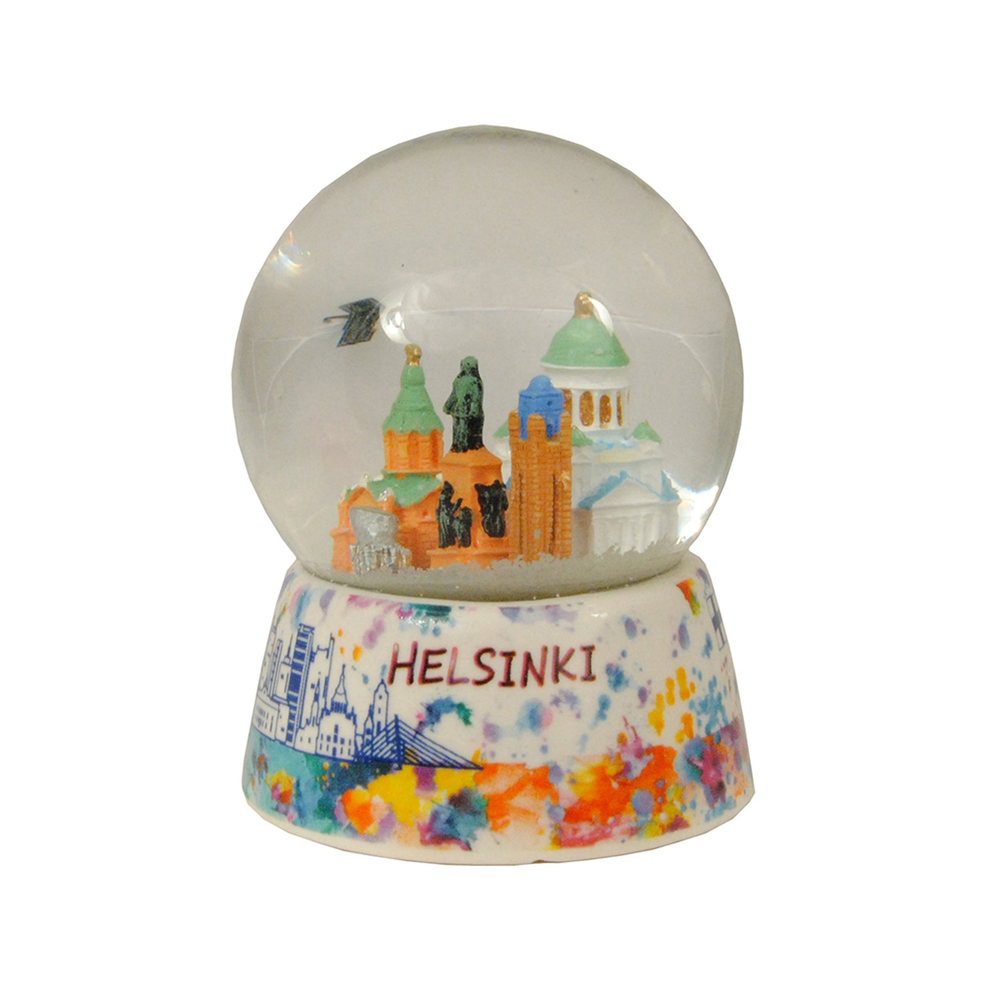 Färgstark souvenirvattenglob med Helsingfors domkyrka i centrum, omgiven av snöeffekt. Sockel i porslin med vattenfärgsliknande illustrationer av Helsingforsmotiv. Text: "Helsinki"