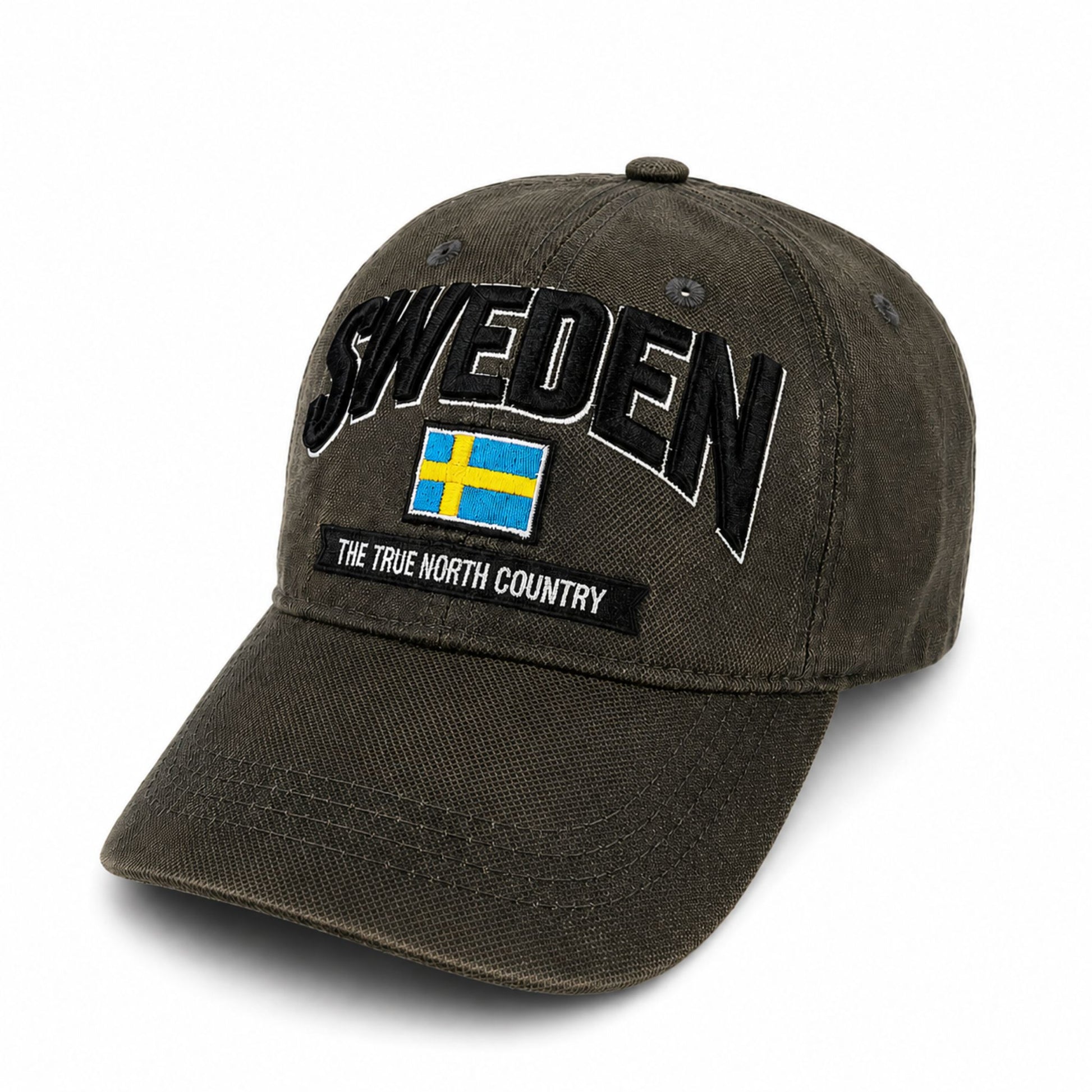 Grå vaxad keps med 3D-flagga, texten "Sweden" och "The true north country" på framsidan – en keps med unik struktur som verkligen sticker ut.